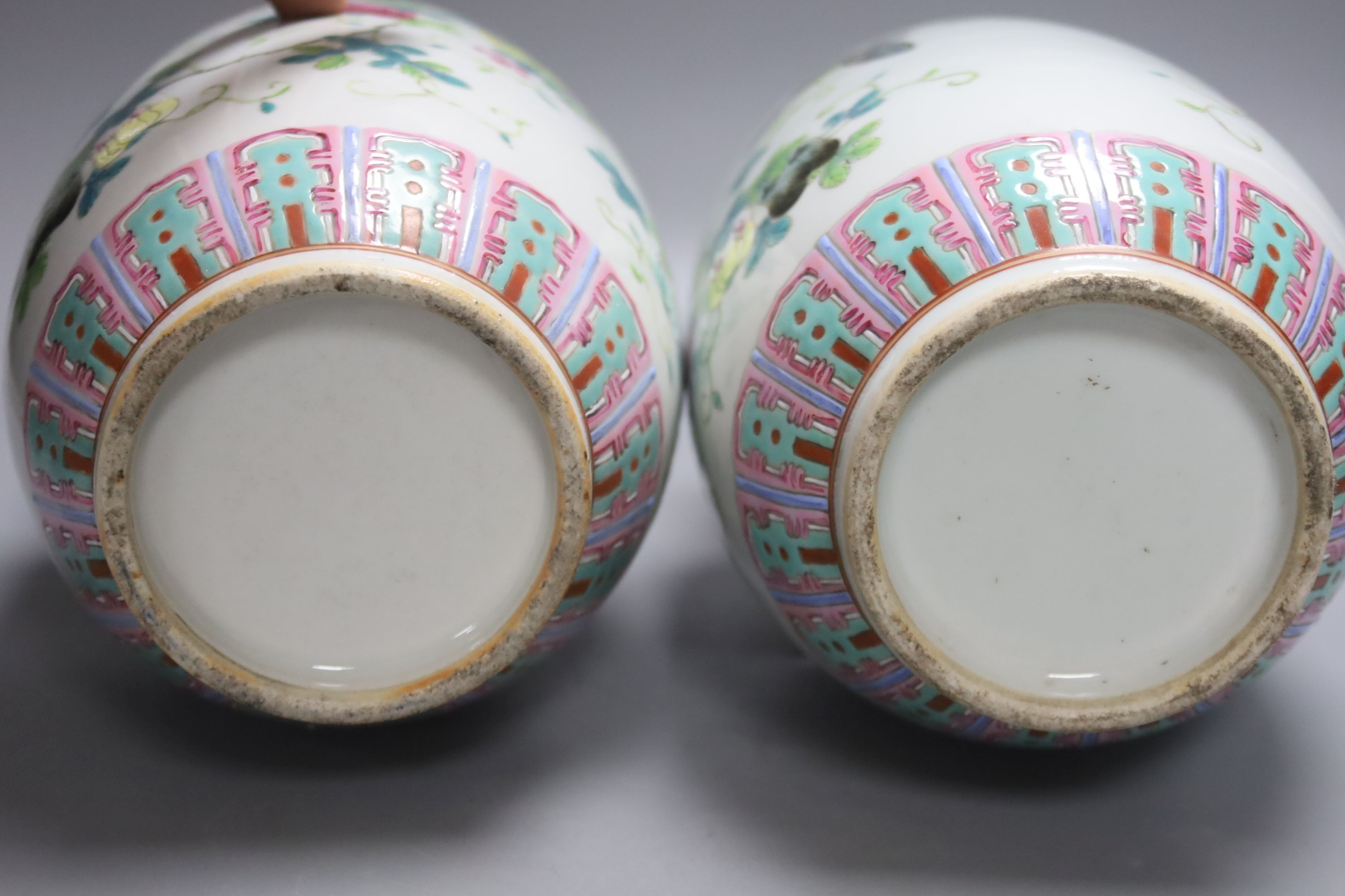 A pair of Chinese famille rose vase and covers, height 26cm